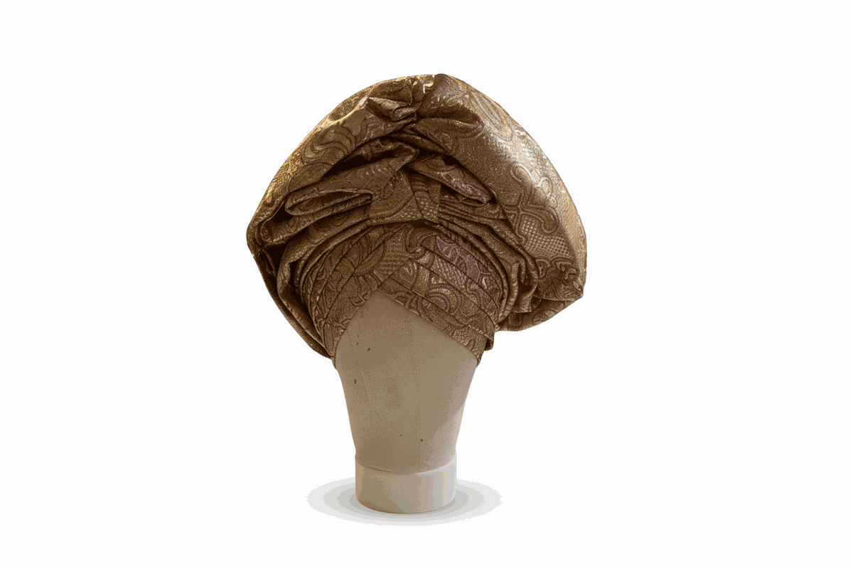 African auto-gele headtie by Bentix, featuring vibrant traditional fabric with intricate patterns and elegant styling.
