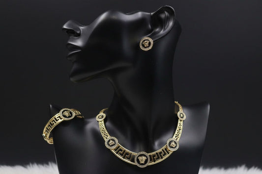 Gold and black jewelry set by BENTIX featuring elegant earrings and necklace with Brazilian gold and black accents.
