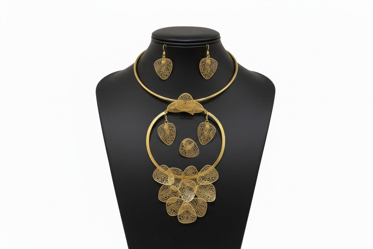 Gold floral necklace, bangle, ring, and earrings set by Bentix featuring intricate Brazilian gold jewelry design.
