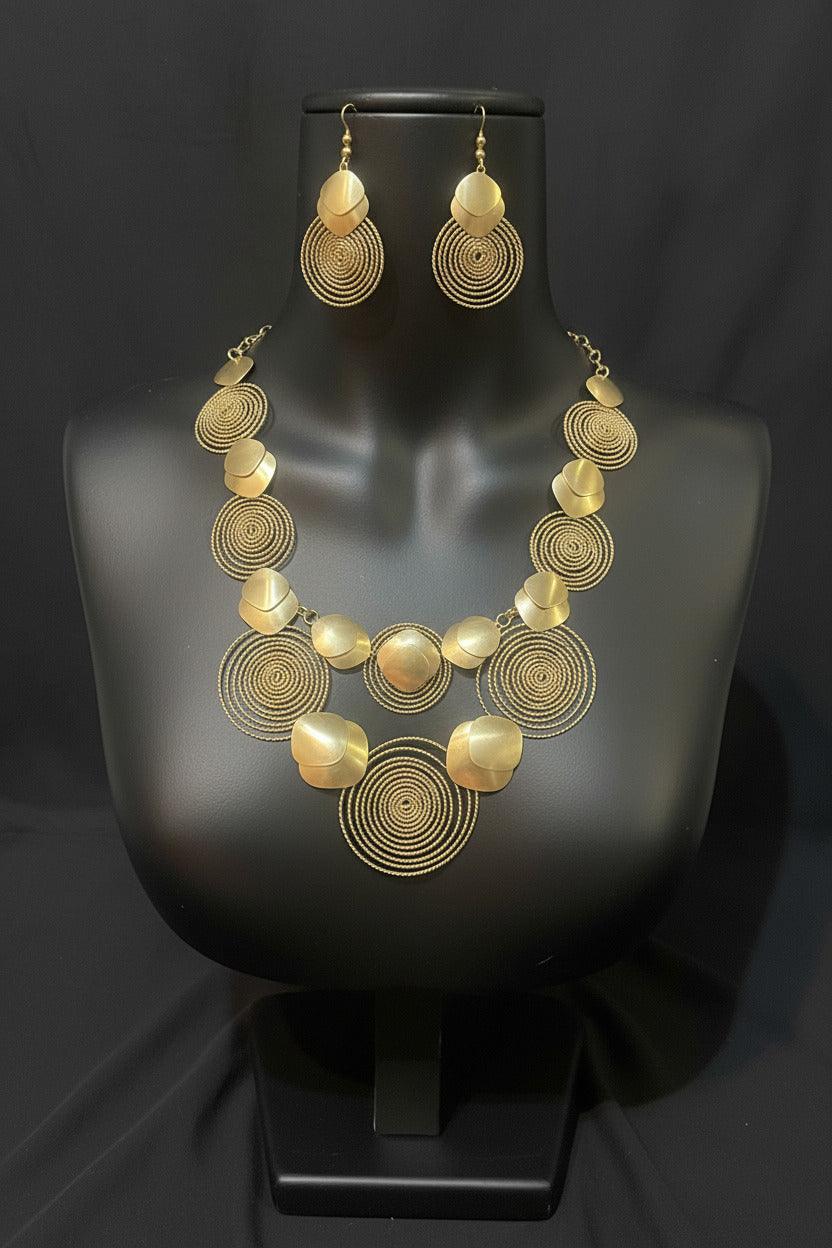 Gold necklace set with circular designs by BENTIX, featuring intricate Brazilian-inspired jewelry for a stylish look.