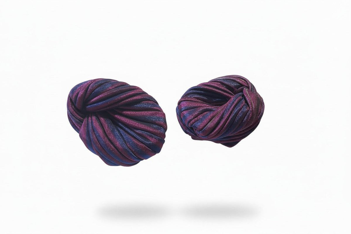 Purple and white striped Nigerian turban by BENTIX, showcasing traditional headwrap style with vibrant fabric pattern.