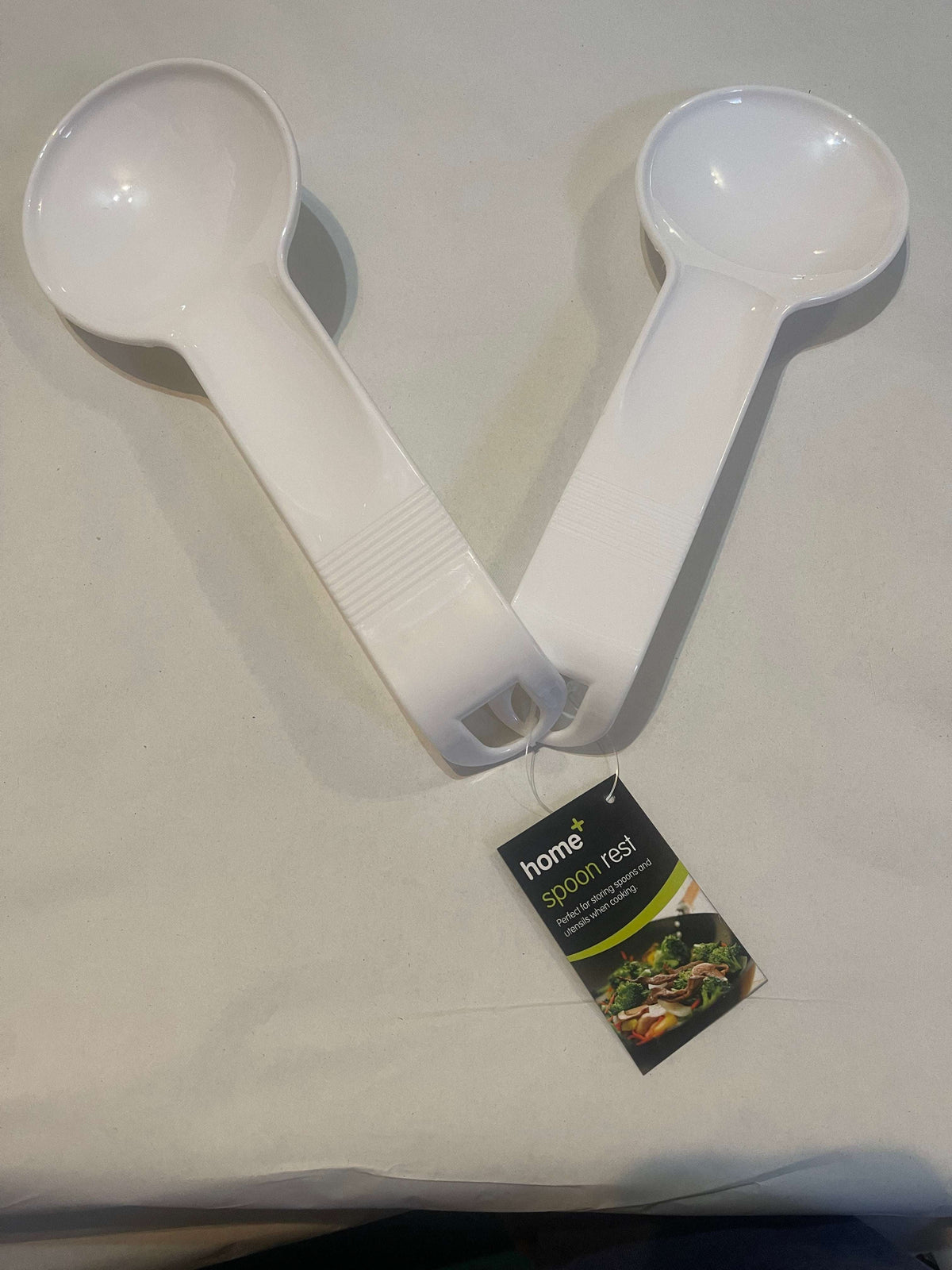 Two plastic serving spoons from BENTIX, lightweight and durable, ideal for serving salads, desserts, or side dishes.