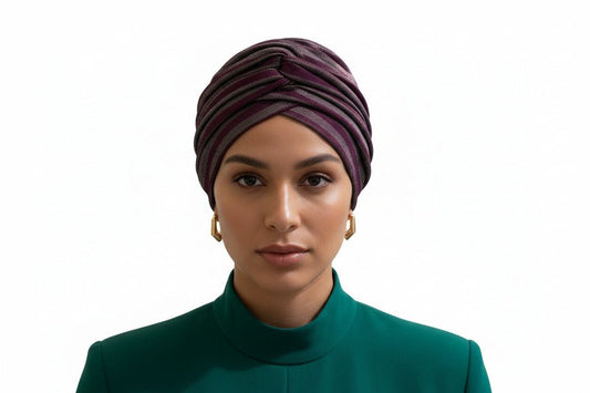 Purple and white striped Nigerian turban by BENTIX, featuring traditional fabric wrapping and vibrant color pattern.