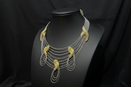 Bentix Brazilian round gold and silver jewelry set with matching earrings and necklace on display.