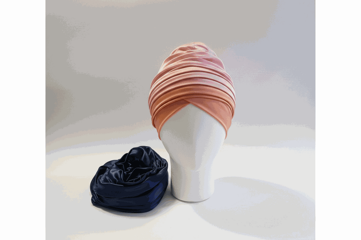 Nigerian pink and blue turban wear by BENTIX featuring vibrant fabric and traditional headwrap style.