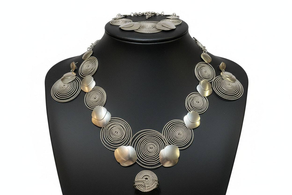 Silver necklace by BENTIX featuring circular silver design elements, showcasing intricate craftsmanship and stylish jewelry.