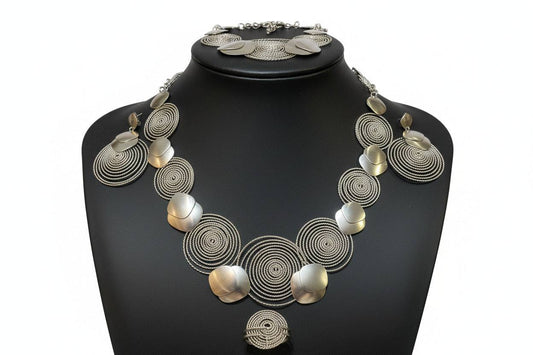 Silver necklace by BENTIX featuring circular silver design elements, showcasing intricate craftsmanship and stylish jewelry.
