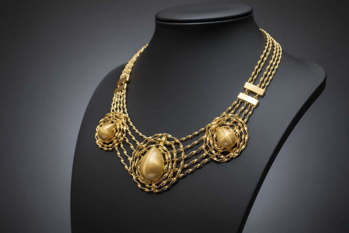 BENTIX Bentix Brazilian Gold jewelry set featuring a bracelet, bangle, earrings, and ring with spherical elements.