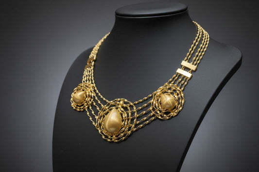 BENTIX Bentix Brazilian Gold jewelry set featuring a bracelet, bangle, earrings, and ring with spherical elements.